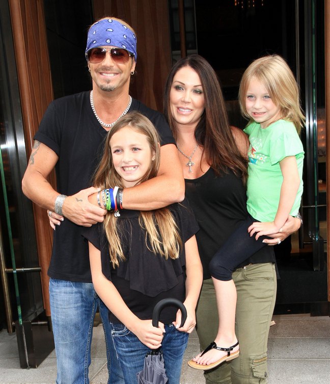 Bret Michaels, black tshirt, blue bandana, bracelets, jeans